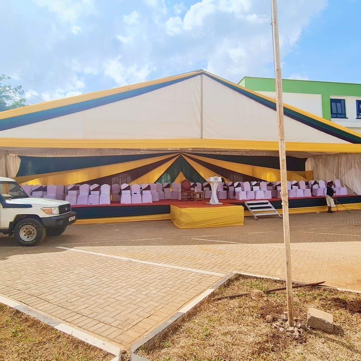 High peak dome tent setup with stage lighting