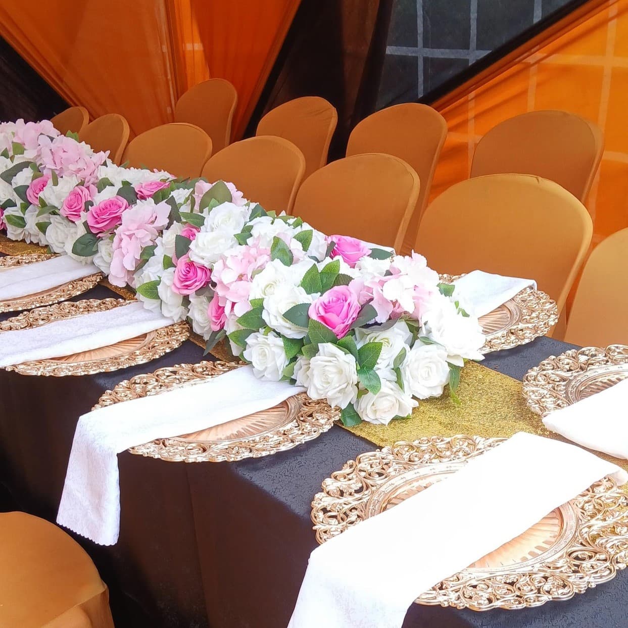 Fine dining banquet table setting with customized gold cutlery