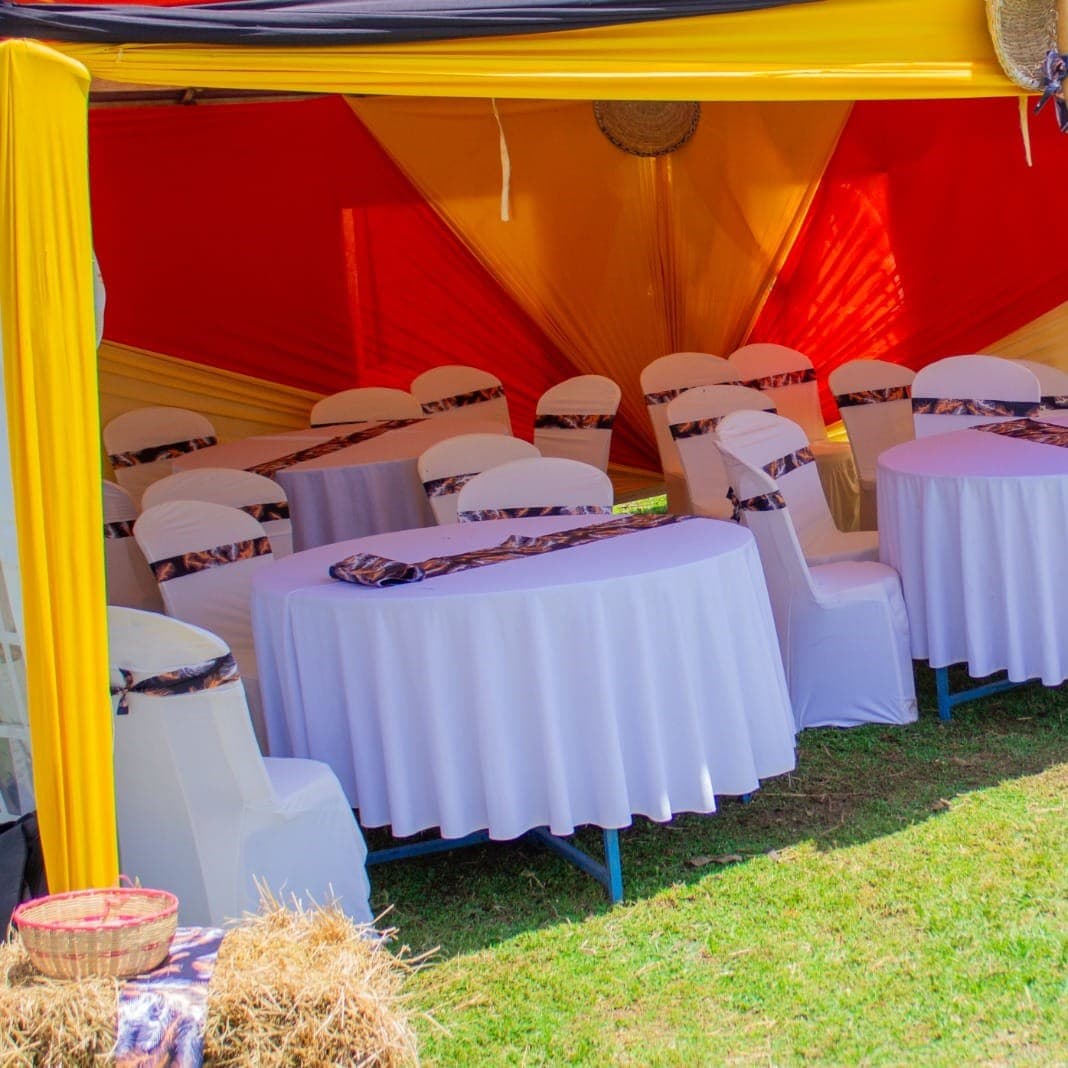 Atmospheric amber uplighting and candle centerpieces